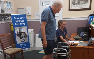 Nurse Sarah tests a man's balance at Hastings Medical Centre